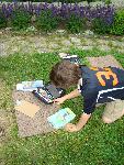 A Young Boy Sketching with Pastels