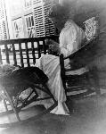 Ella Sewing on the Weir House Porch