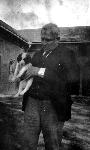 J. Alden Weir with a Puppy