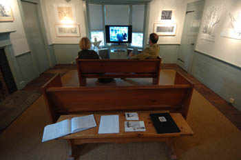 Visitors watching the 13-minute introductory film, "Legacy of a Landscape." 
