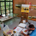 An artist in the Artist-in-Residence studio at Weir Farm NHS.
