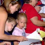 A reading of the Declaration of Independence featuring special guest John Adams and members of the audience.