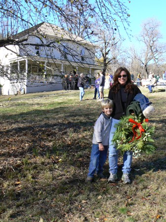 Cindy Milestone and her son, Sheridan, with their holiday wreath