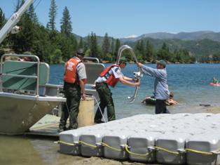 YCC crew-member assisting park staff with lake operations 