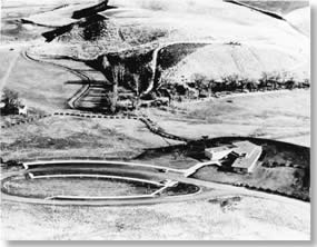Historic photo: Ariel view looking down on new visitor center and circular parking area.