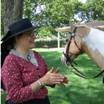 Woman in period dress with horse