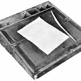 Portable writing desk with quill pen and paper.