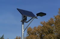 Close-up of solar panel on parking lot light poles.