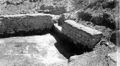 Exposed adobe wall. Individual bricks are visible.