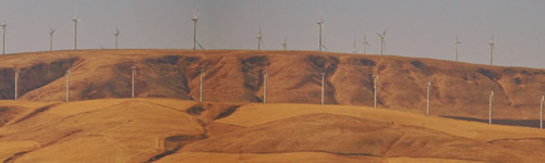 Modern windmills on distant hills