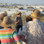 ranger leading a group on the dunes