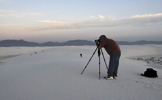 visitor taking a picture of the dunes