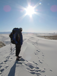backpacker on dunes