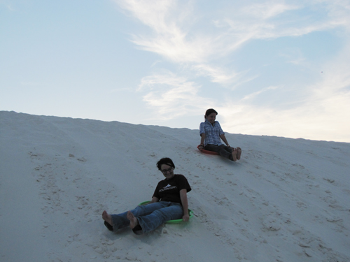 slender sliding down dunes