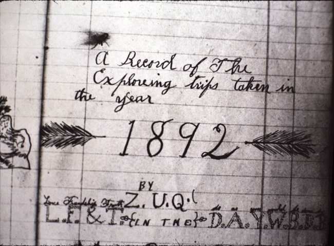 black and white photo of an old journal entry reading "A Record of the Exploreing (sic) taken in the year 1892, by Z.U.Q."