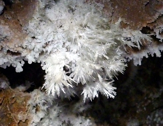 Close-up photo of a brilliant white rock formation that looks like frost.