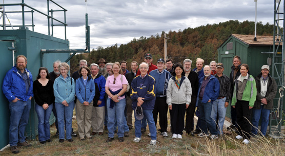 Members of the IMPROVE steering committee standing by monitoring equipment at Wind Cave National Park