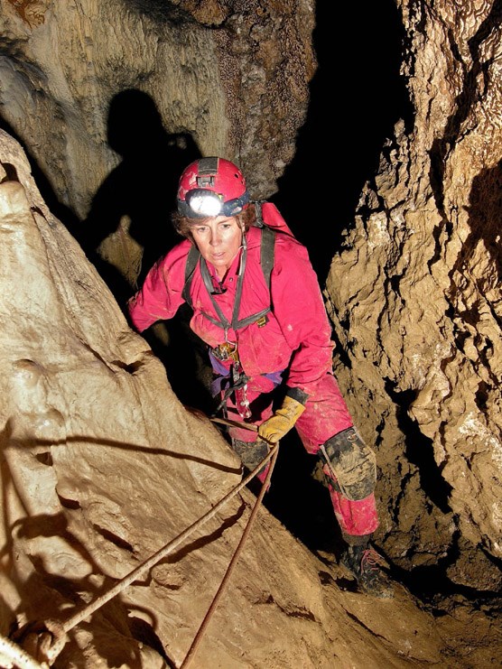 Dr. Louise Hose, seen here caving in Italy, will present a program at Wind Cave on May 27.