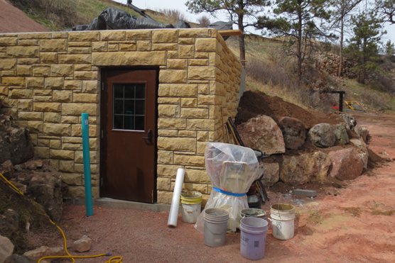 View of small building, the airlock, under construction.