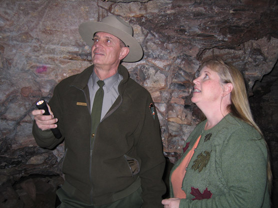 Ranger showing visitor a room in Wind Cave.