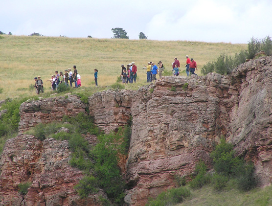 A ranger-led tour overlooking a cliff.