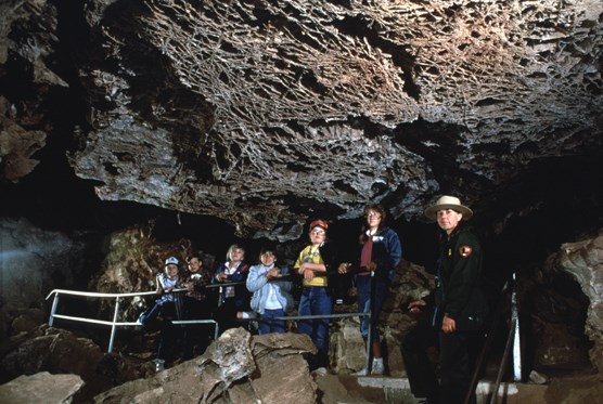 Ranger leading a tour in Wind Cave to a group of visitors