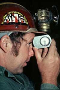 Caver reading an inclinometer.
