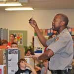 A William Howard Taft NHS ranger speaks with kids in the classroom