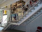 Stairway to the second floor with photos