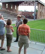 John Stoudt talking to a group on a walking tour. In front of the Wesleyan Chapel.