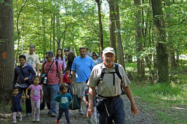 A park volunteer leads a guided hike on the Wolf Trap Trail.