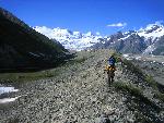Backpacker crossing glacial moraine
