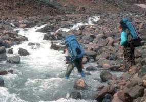 Crossing an icy glacial stream