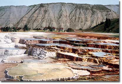 Hymen Terrace, Mammoth Hot Springs, with Fort Yellowstone in the background.
