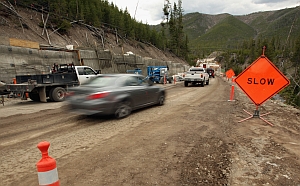 Travel through Gibbon Canyon continues along the old route as work on the new bridge nears completion