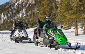 Two snowmobilers