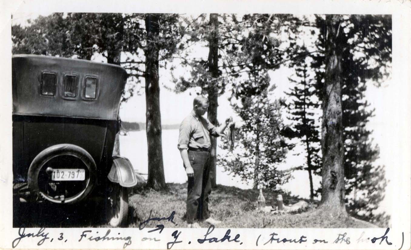 Jack Hervat fishing in Yellowstone Lake (trout on hook)