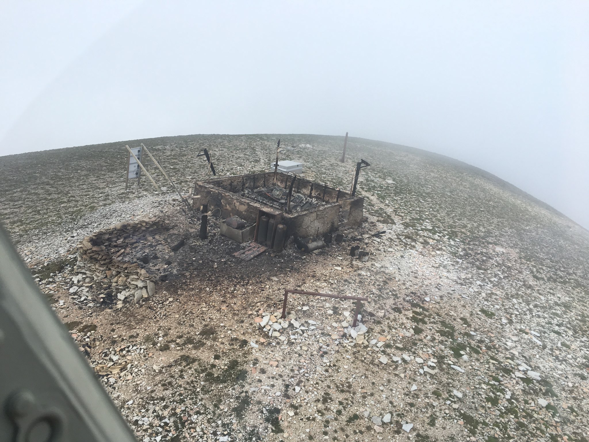 burned fire lookout on top of mountain