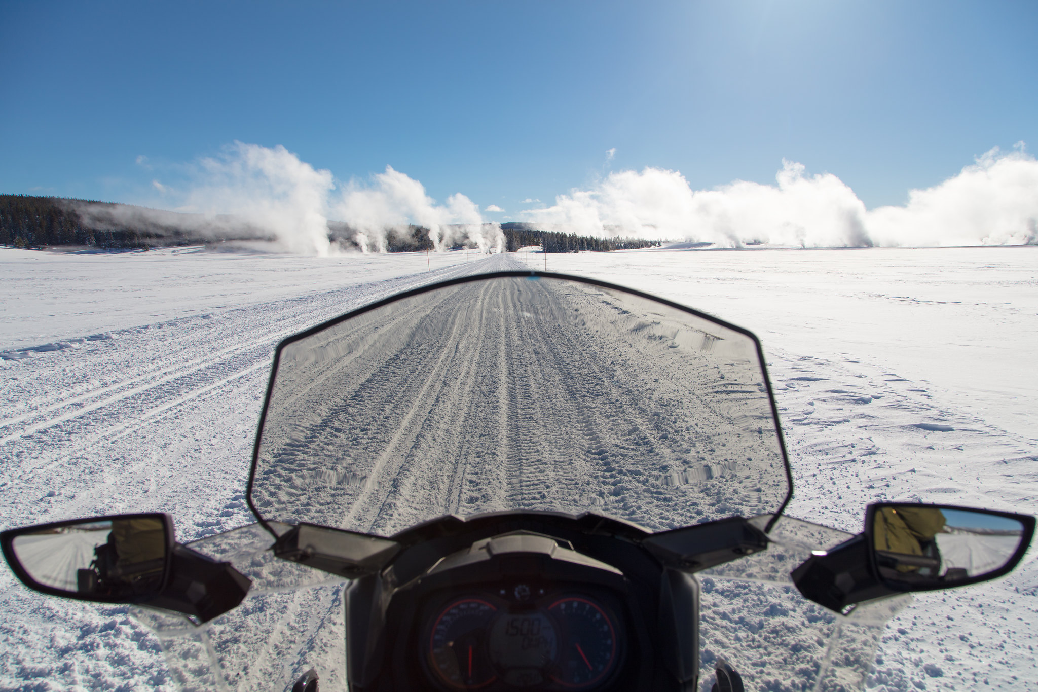 view from a snowmobile on a winter road