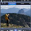 A backpacker stands looking at the Yellowstone landscape.