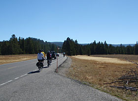 Bikers riding on the Grand Loop in Yellowstone National Park.