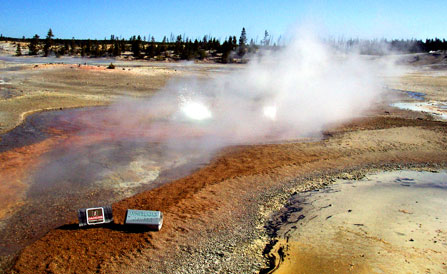 Whirligig Geyser begins to erupt amidst the orange-yellow iron oxide deposits surrounding it in Porcelain Basin.
