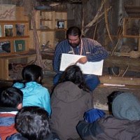 Indian cultural demonstrator working with students.
