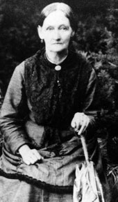 An older woman poses for portrait