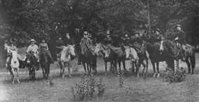 Pioneers on horseback pose for a photo