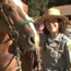 Ranger standing next to horse