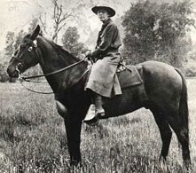 B&W photo of ranger Clare Marie Hodges on horseback
