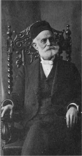 Portrait of Hutchings sitting in a chair