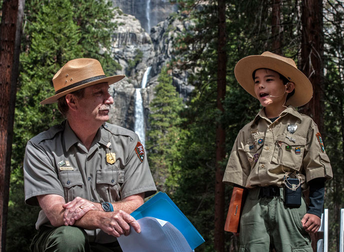 Superintendent Don Neubacher and "Ranger Gabriel" with Yosemite Falls in the background