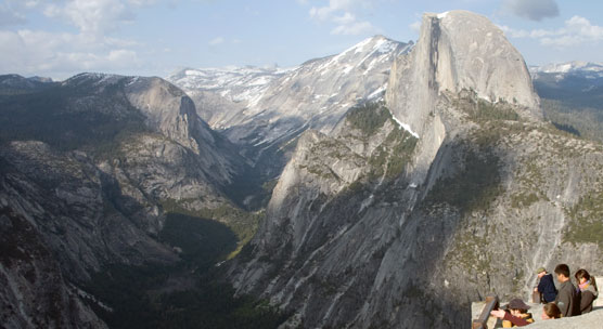 People peer over Glacier Point